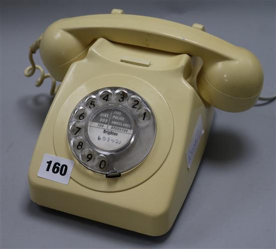 A cream bakelite telephone